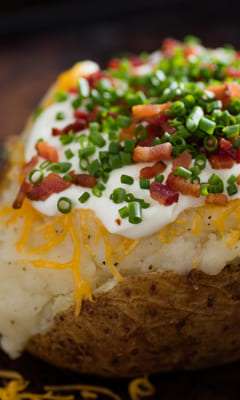 Baked potato with brynza and cheese with spices