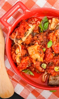 Fish with vegetables in tomato sauce