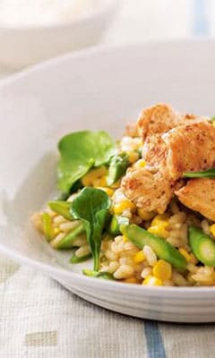 Creamy risotto with chicken, vegetables and cheese