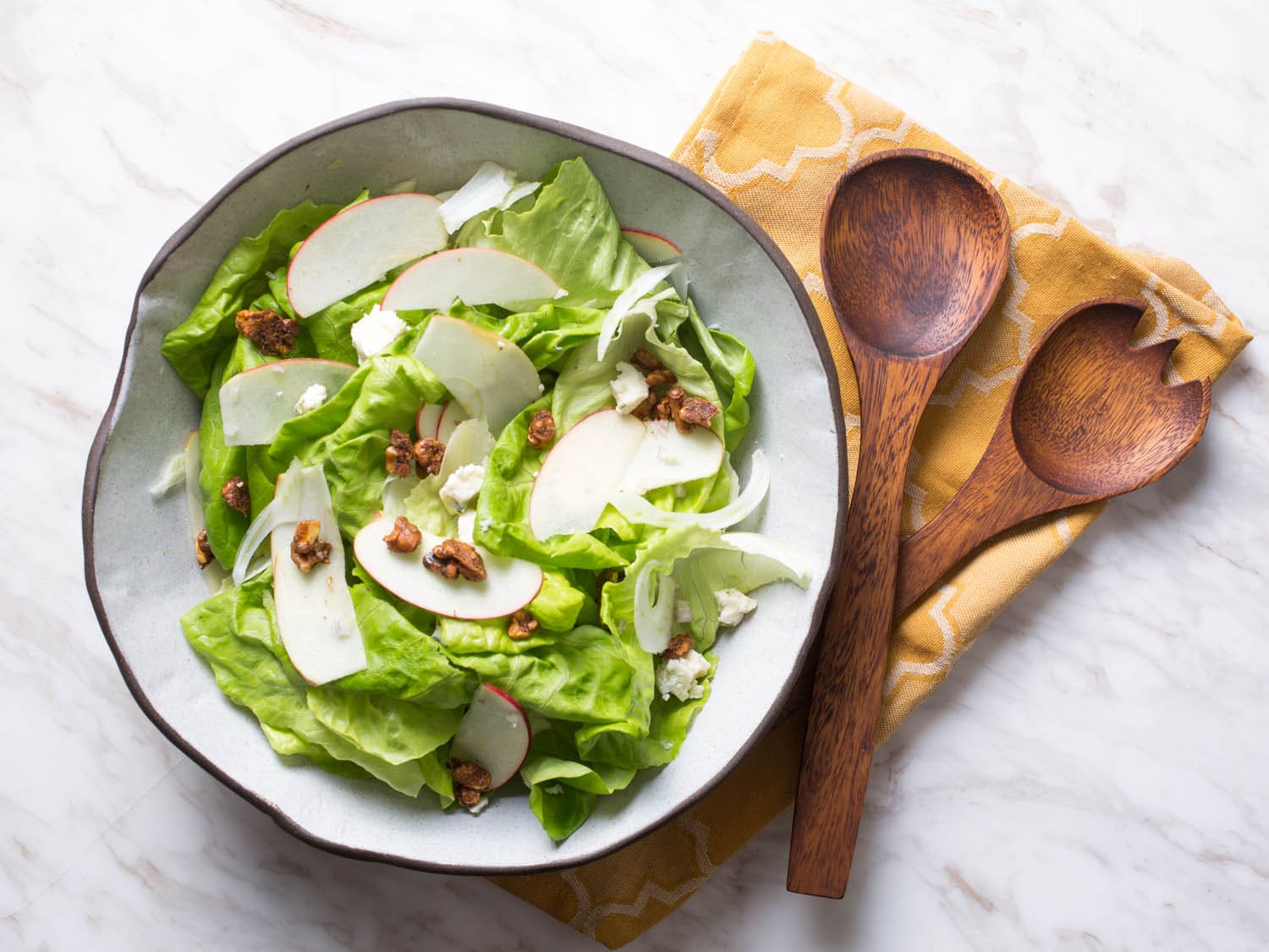 Apple salad with brynza and orange topping