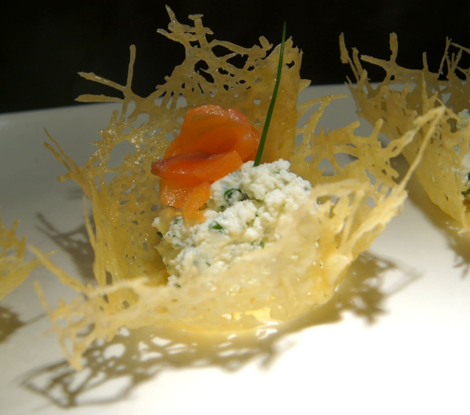 Appetizer with salmon and ricotta in cheese buscets