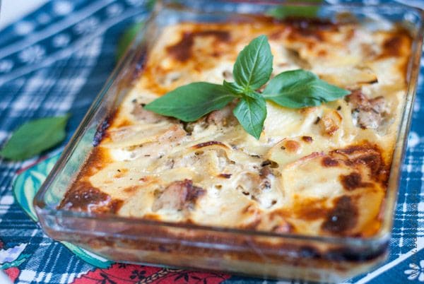 Chicken with potatoes covered with cheese